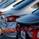 In this Sunday, Feb. 3, 2019, file photograph, a long row of unsold 2019 Cruze sedans sits at a Chevrolet dealership in Littleton, Colo.